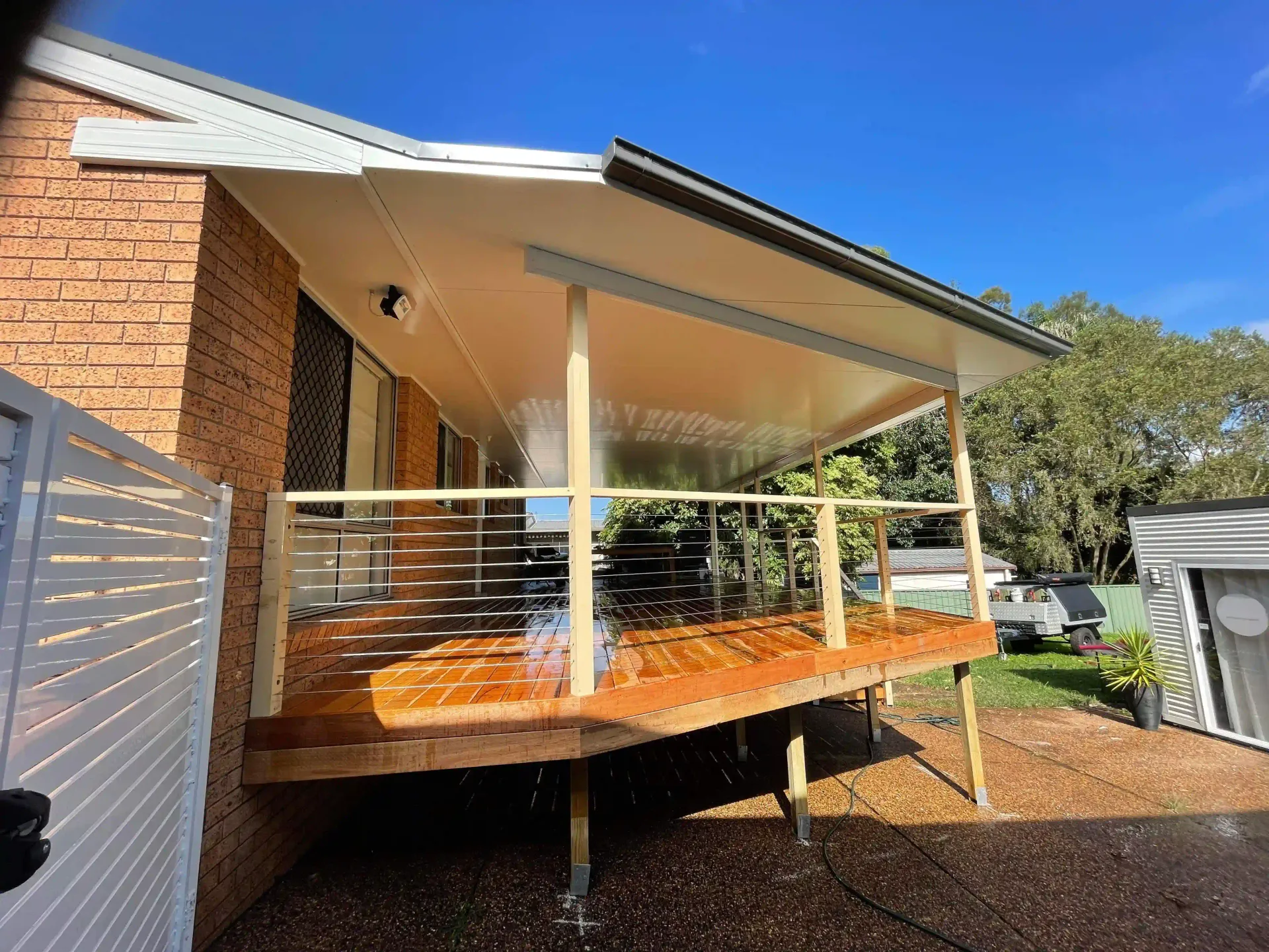 Flat-roof patio cover built over a paved area in Newcastle