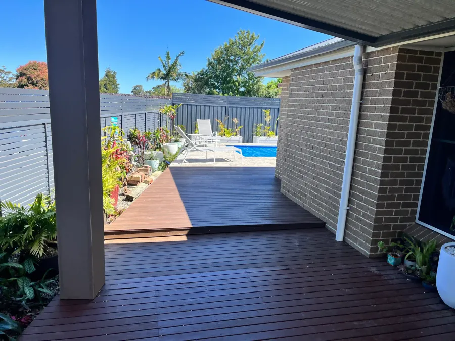 Hardwood deck leading to a pool built in Newcastle